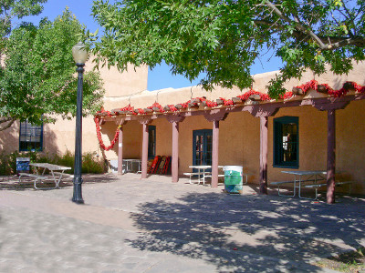 [Adobe style buildins with red pepper garland decorations.]